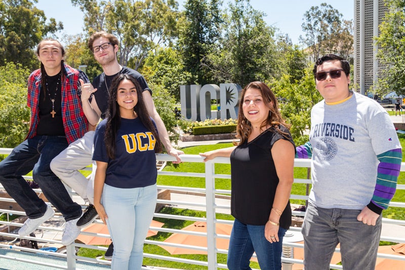 Students and staff members of UCR's TRIO Scholars program smile for a photo. 